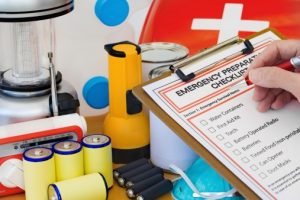 Hand-completing-Emergency-Preparation-List-by-Equipment