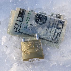 Frozen dollars with padlock