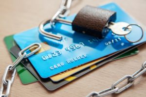Credit cards with an open lock and chain. Open access to the use of electronic money