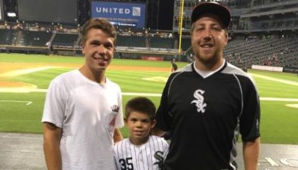 Jack enjoys a White Sox game with his friend and his little brother.