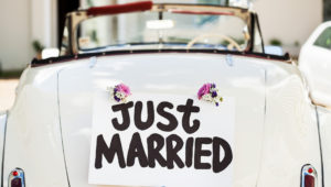 "Just Married" Sign Attached On Car's Trunk