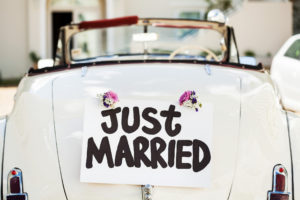 "Just Married" Sign Attached On Car's Trunk