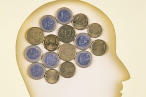 Human head in paper cut style  and Euro coins
