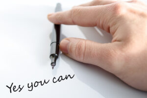 Pen in the hand isolated over white background Yes you can concept