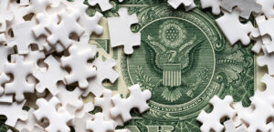 2025-10-07_Dollar bill with puzzle pieces