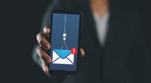 Phishing bait alert concept on a smartphone screen. Man got scam alert. emergency system hacked alert. scam and cyber security concept.