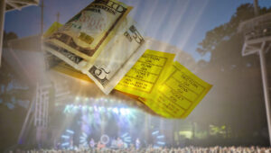 Concert tickets with cash and crowd -- ticket price concept
