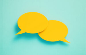 Yellow speech bubbles on blue background.